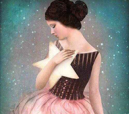 дівчина тримає зірку