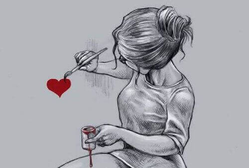дівчина малює серце