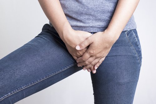 біль в області паху