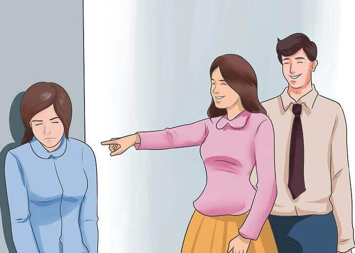 пара насміхається з дівчини